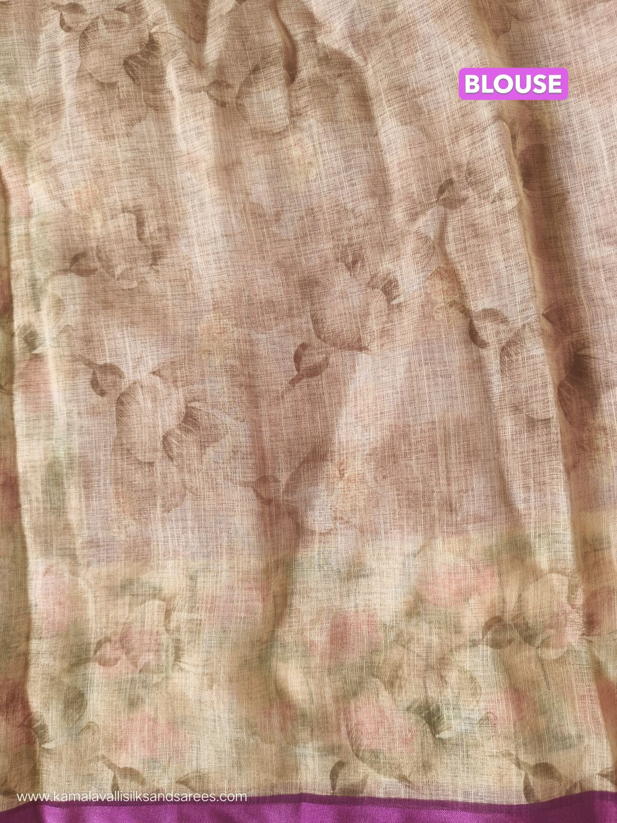 Floral blouse fabric with a visible brand name on a plain background